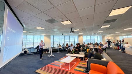 A man giving presentation in front of audience